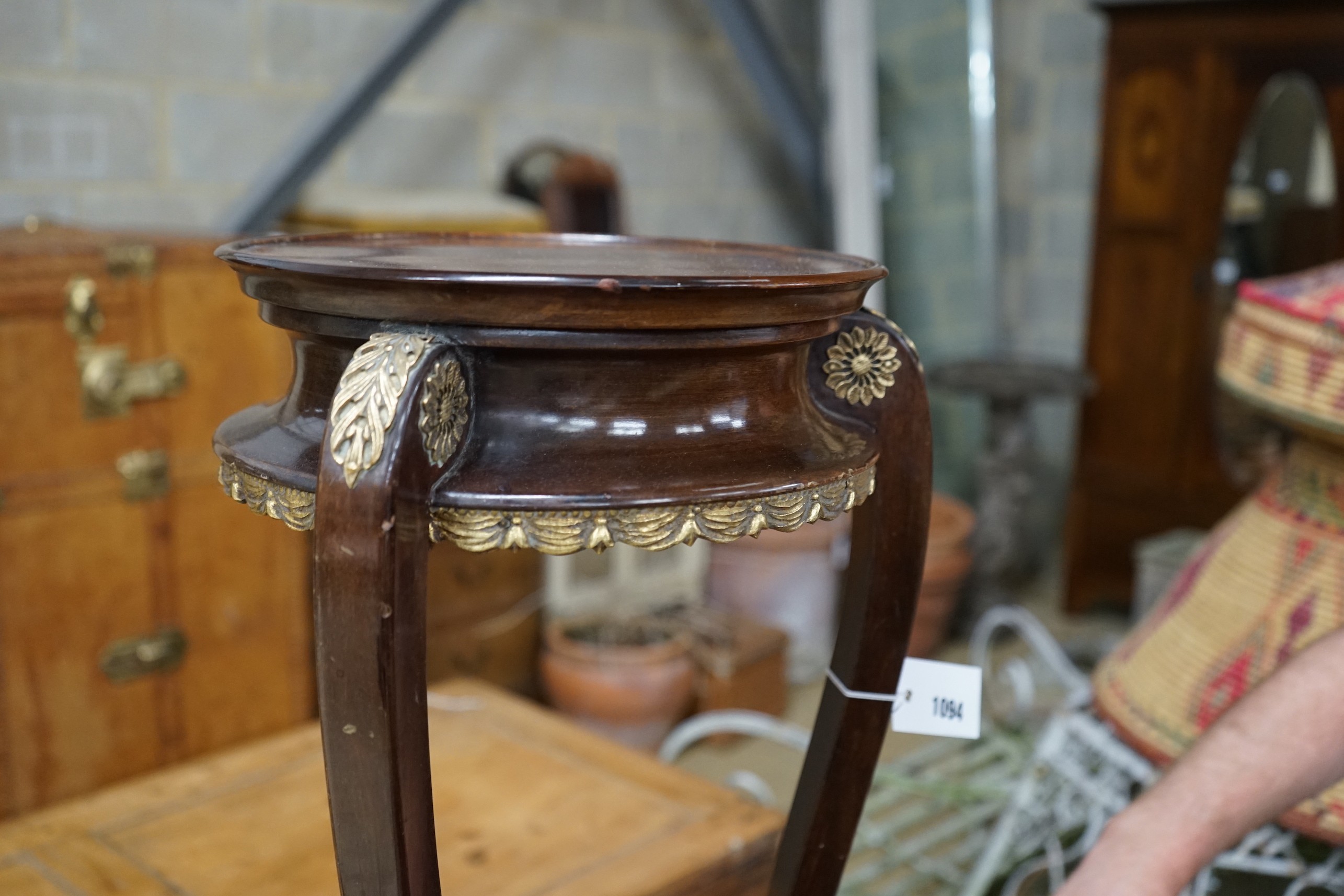 A French gilt metal mounted mahogany Empire style vase stand, height 67cm